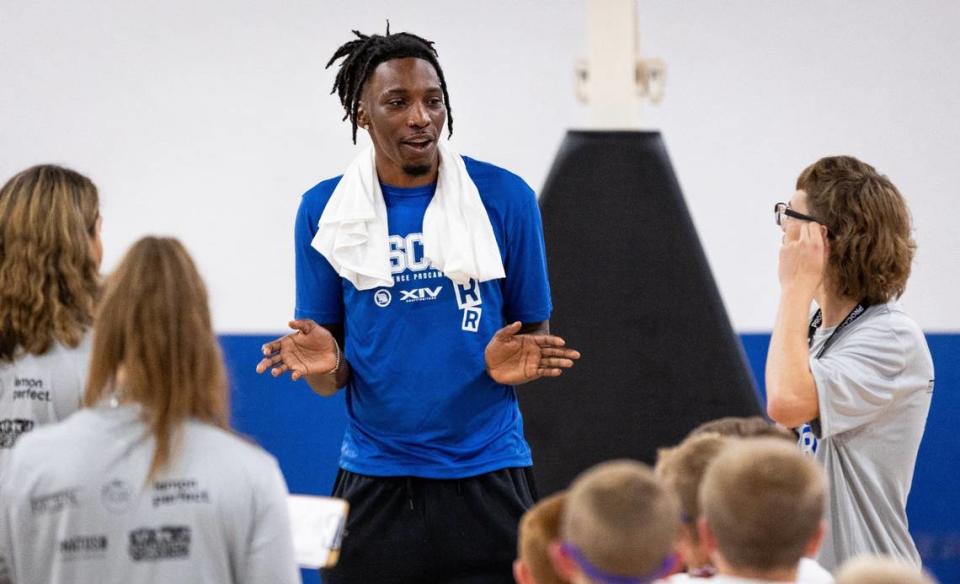 Kentucky freshman Aaron Bradshaw talks to campers during Oscar Tshiebwe’s youth basketball camp in Lexington on Aug. 27.