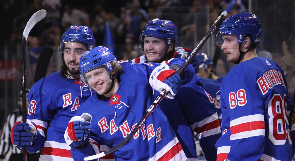 Artemi Panarin celebrates his first goal with the New York Rangers alongside Mika Zibanejad, Jacob Trouba and Pavel Buchnevich during the second period against the Winnipeg Jets at Madison Square Garden on October 03, 2019 in New York City. (Photo by Bruce Bennett/Getty Images)