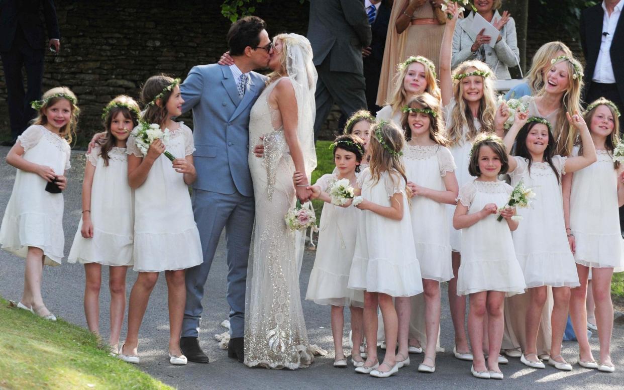 Kate Moss's wedding to Jamie Hince featured more than a dozen bridesmaids, flouting Country Life's advice that smaller is better - PA