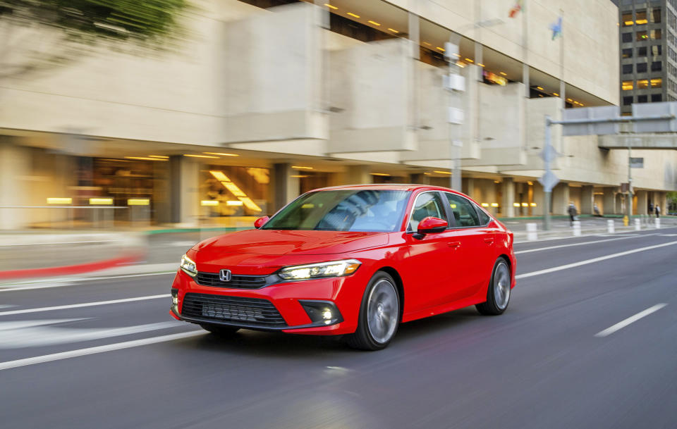 This photo provided by Honda shows the 2022 Honda Civic. It's a midsize compact sedan or hatchback with a starting price of about $24,000. (Courtesy of American Honda Motor Co. via AP)