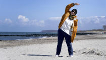 Simone Ravera, patient of the 'MEDIAN Clinic Heiligendamm', makes exercises after an interview with the Associated Press in Heiligendamm, northern Germany, Wednesday, April 14, 2021. The MEDIAN Clinic, specialized on lung diseases, treats COVID-19 long time patients from all over Germany. (AP Photo/Michael Sohn)