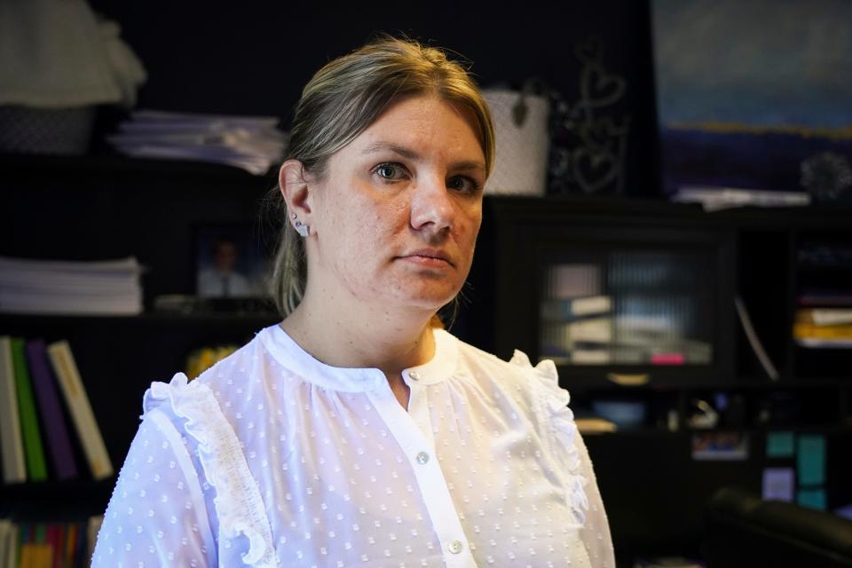 Aimee Bock, the executive director of the nonprofit Feeding Our Future, speaks, Thursday, Jan. 27, 2022 in St. Anthony, Minn. (Shari L. Gross/Star Tribune via AP)