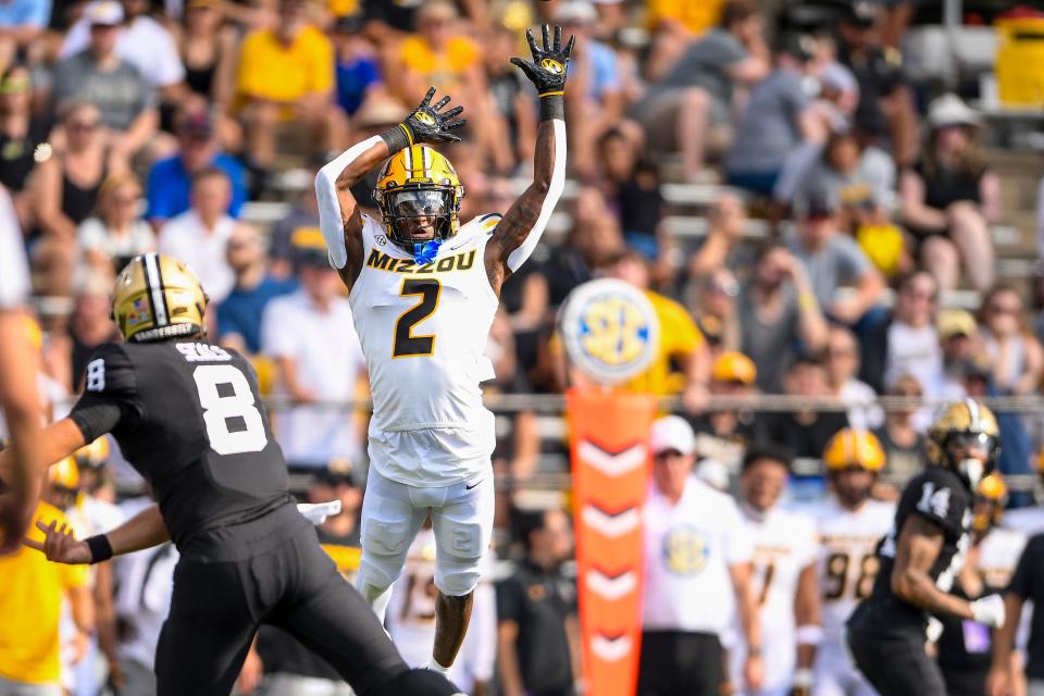 Sep 30, 2023; Nashville, Tennessee, USA; Vanderbilt Commodores quarterback Ken Seals (8) throws a pass over the arms of Missouri Tigers defensive back Ennis Rakestraw Jr. (2) during the first half at FirstBank Stadium.