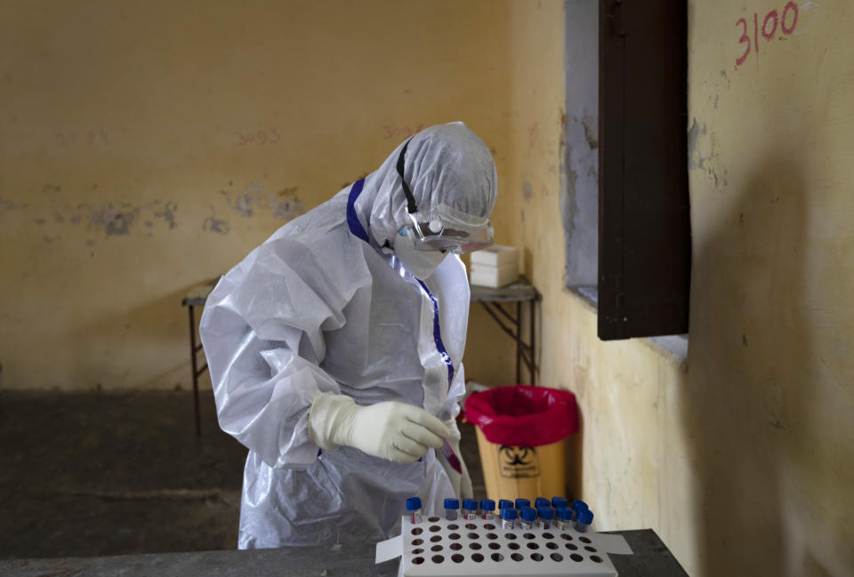 A health worker stores nasal swab samples to test for COVID-19 in Prayagraj, India, Friday, Aug. 7, 2020. As India hit another grim milestone in the coronavirus pandemic on Friday, crossing 2 million cases and more than 41,000 deaths, community health volunteers went on strike complaining they were ill-equipped to respond to the wave of infection in rural areas. (AP Photo/Rajesh Kumar Singh)