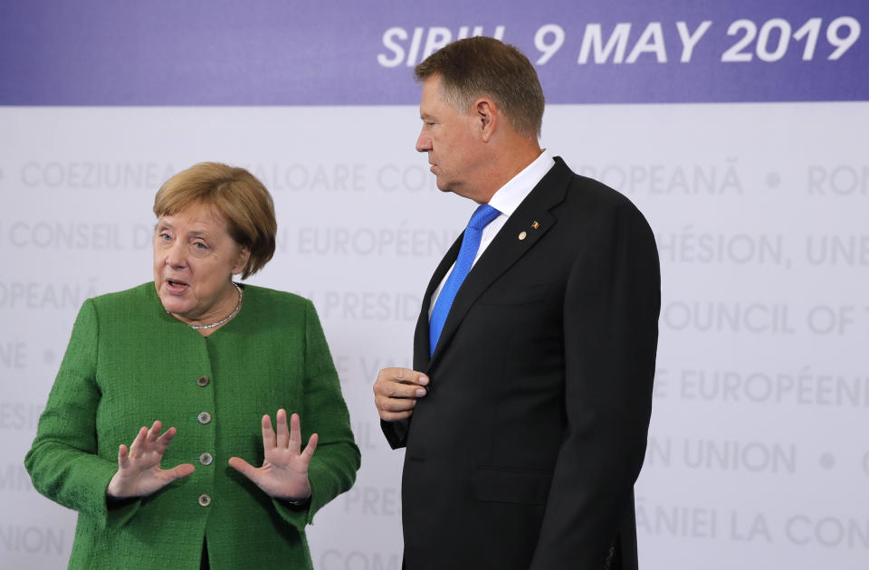 <p>German Chancellor Angela Merkel, left, speaks with Romanian President Klaus Werner Ioannis as she arrives for an EU summit in Sibiu, Romania, Thursday, May 9, 2019. European Union leaders on Thursday start to set out a course for increased political cooperation in the wake of the impending departure of the United Kingdom from the bloc. (AP Photo/Vadim Ghirda) </p>