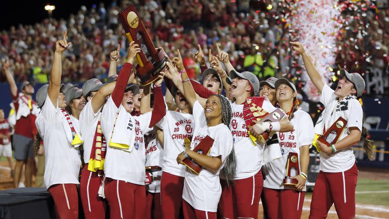 Oklahoma players celebrate with the trophy after defeating Florida State in the NCAA Women’s College World Series championship series, Thursday, June 8, 2023, in Oklahoma City. (AP Photo/Nate Billings)