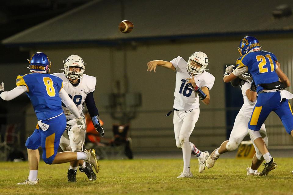 Central Valley quarterback Dawson Hill (16) throws a pass to a teammate during the third quarter against Anderson on Friday night, Oct. 15, 2021. CV won 21-6.