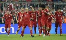 Bayern Munich's players celebrate after scoring during their Champions League semi final first leg match against Barcelona on April 23, 2013