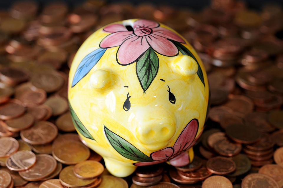 A piggy bank on a pile of coins.   (Photo by Nick Ansell/PA Images via Getty Images)