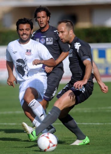 Ajaccio's Johan Cavalu (L) vies with Toulouse's Etienne Didot during their French Ligue 1 friendly match, on July 21, in Aire-sur-l'Adour, western France. Toulouse play Montpellier in the league season opener on Friday