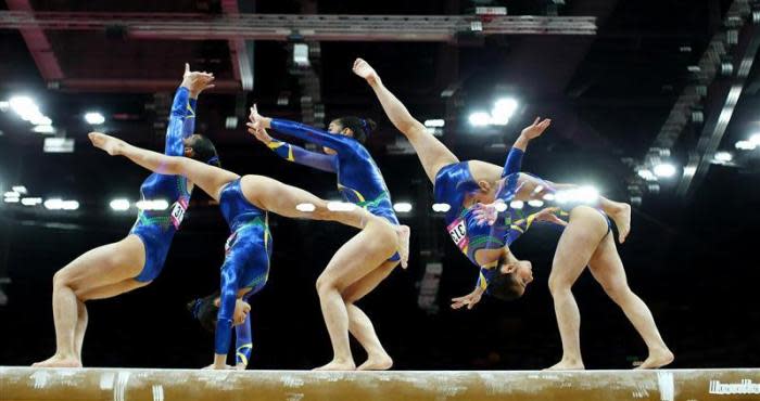 Bruna Kuroiwa Yamamoto Leal of Brazil competes in the balance beam during the women's gymnastics qualification in the North Greenwich Arena during the London 2012 Olympic Games July 29, 2012.