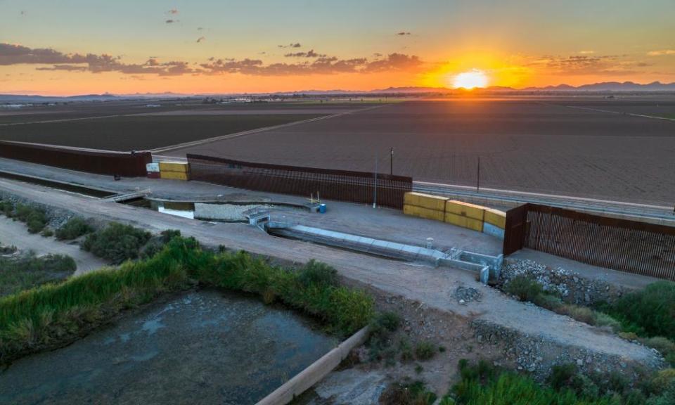 Shipping crates fill gaps in the border wall near Yuma, Arizona.