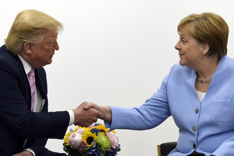 President Donald Trump meets with German Chancellor Angela Merkel on the sidelines of the G-20 summit in Osaka, Japan, Friday, June 28, 2019. (AP Photo/Susan Walsh)