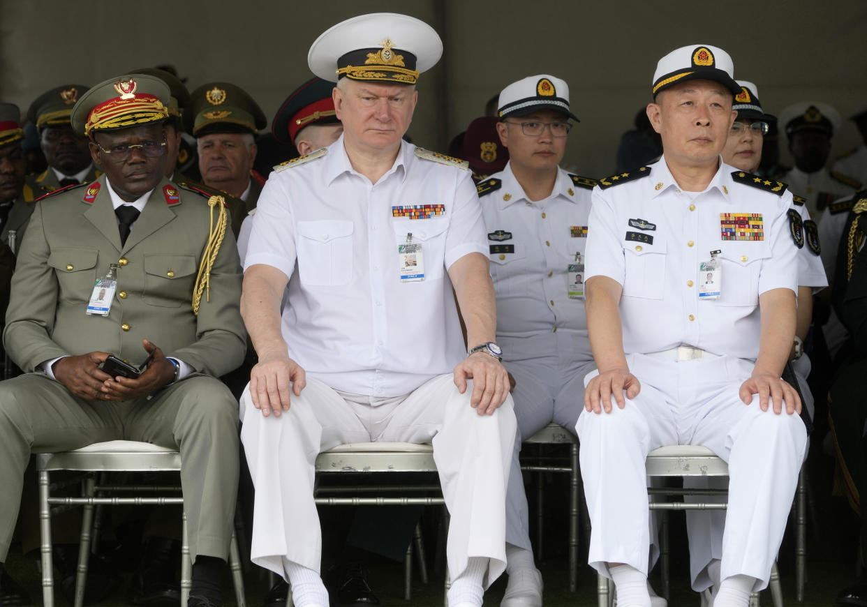 Admiral Nikolai Yevmenov, Commander-in-Chief of the Russian Navy, center, with Chinese naval officers attend the Armed Forces Day in Richards Bay, South Africa, Tuesday, Feb. 21, 2023. The parade took place as a naval exercise was underway off the east coast of the country with Russian and Chinese navies. (Themba Hadebe)