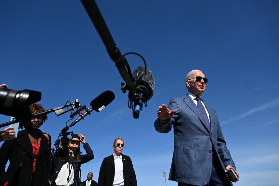 President Joe Biden speaks to the press before boarding Air Force One en route to Ireland on Monday, April 11. (Jim Watson/AFP via Getty Images)