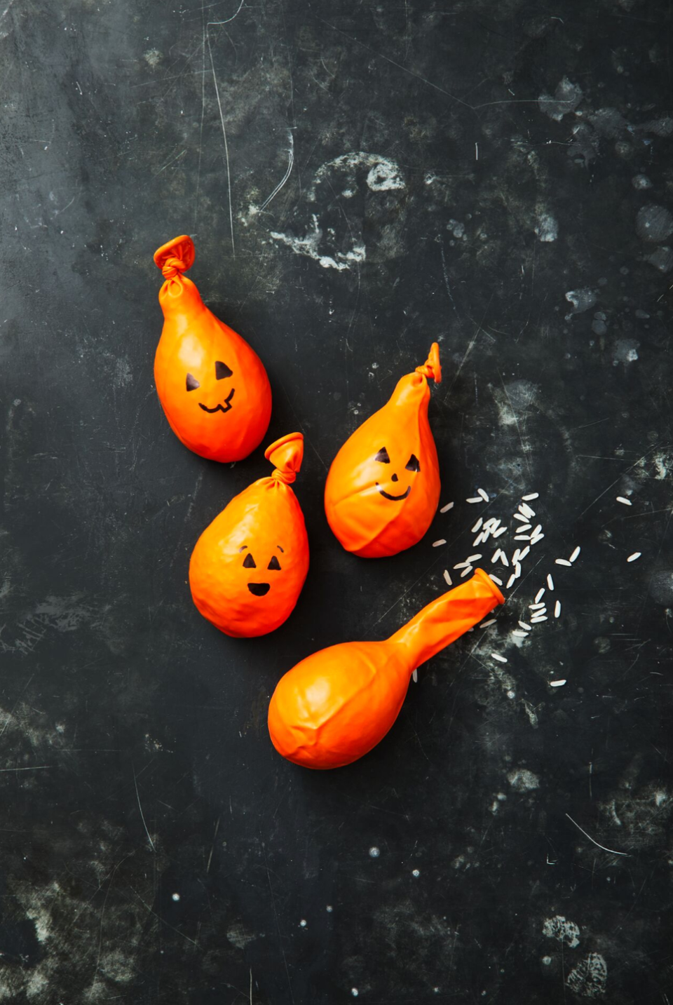 thanksgiving crafts pumpkin stress balls with drawn on faces