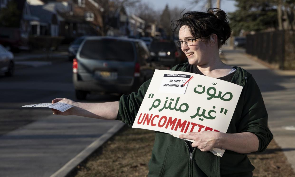 <span>A volunteer with the Listen to Michigan campaign in Dearborn, Michigan, on 27 February 2024.</span><span>Photograph: Anadolu/Getty Images</span>