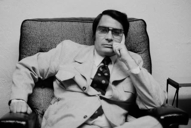 <p>Janet Fries/Getty</p> Jim Jones in his office in San Francisco, California on July 3, 1976.