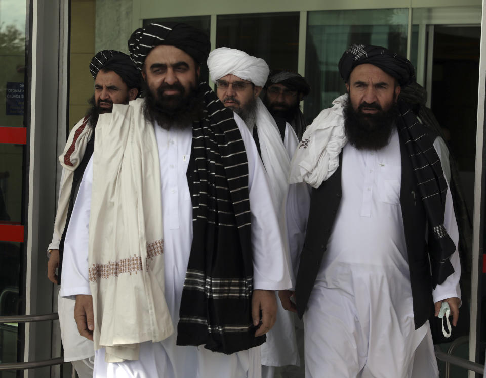 The Taliban delegation led by Amir Khan Muttaqi, the acting foreign minister, front, at Esenboga Airport, arrive in Ankara, Turkey, Thursday, Oct. 14, 2021. A high-level delegation of Afghanistan's new Taliban rulers has arrived in Turkey for talks with Turkish officials, the Foreign Ministry announced Thursday. The meetings in the capital of Ankara would be first between the Taliban and senior Turkish government officials after the group seized control of Afghanistan. (AP Photo/Burhan Ozbilici)