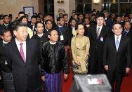 In this Jan. 17, 2020, photo provided by Myanmar News Agency (MNA), Chinese President Xi Jinping, left in front row, Myanmar's President Win Myint, center, and Myanmar's leader Aung San Suu Kyi, right, attend a ceremony to mark the Myanmar-China 70th Anniversary of Establishment of Diplomatic Relations in Naypyitaw, Myanmar.(Myanmar News Agency via AP)