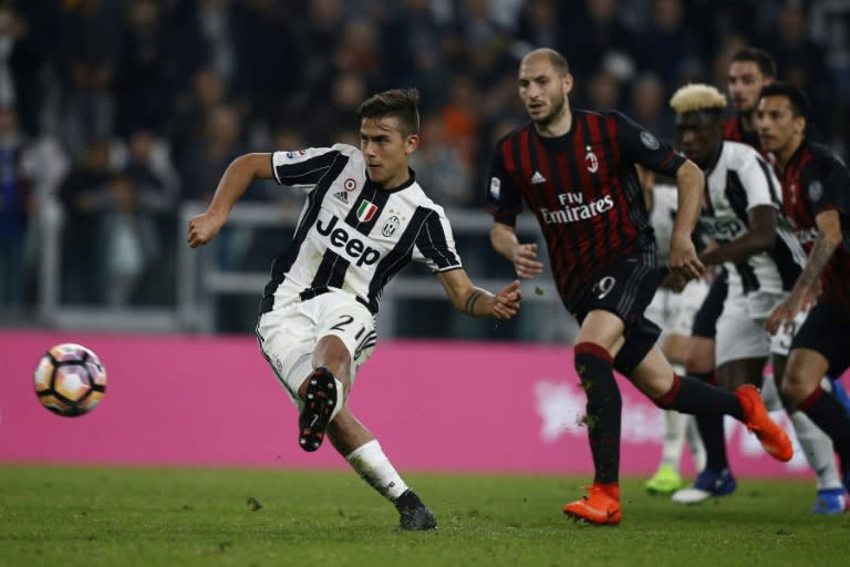 Juventus' forward Paulo Dybala from Argentina scores a penalty during the Italian Serie A football match Juventus Vs AC Milan on March 10, 2017 at the 'Juventus Stadium' in Turin