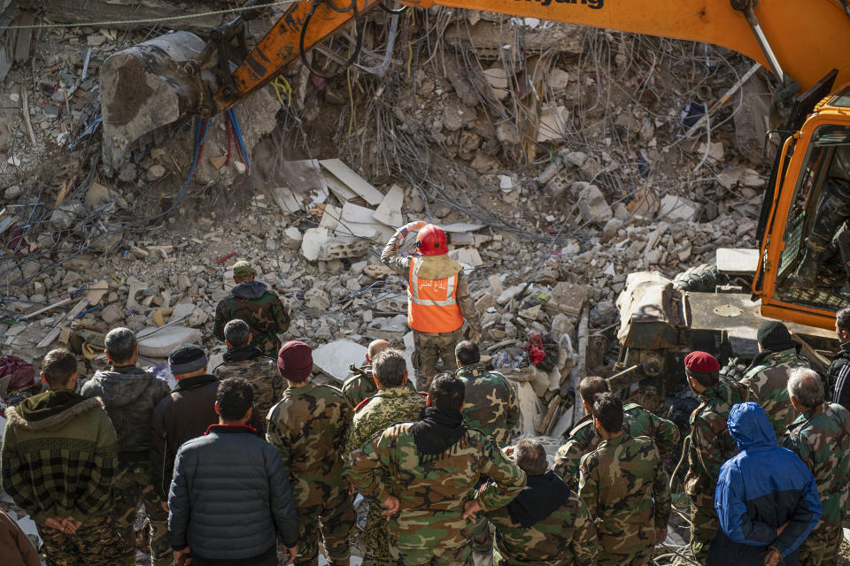 Rescue workers search for survivors in the rubble of a collapsed building in the town of Jableh in Syria's northwestern province of Latakia following an earthquake, on Feb. 7, 2023.<span class="copyright">AFP/Getty Images</span>