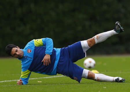 Arsenal's Mikel Arteta exercise during a training session at their training facility in London Colney, north of London, November 3, 2014. REUTERS/Eddie Keogh