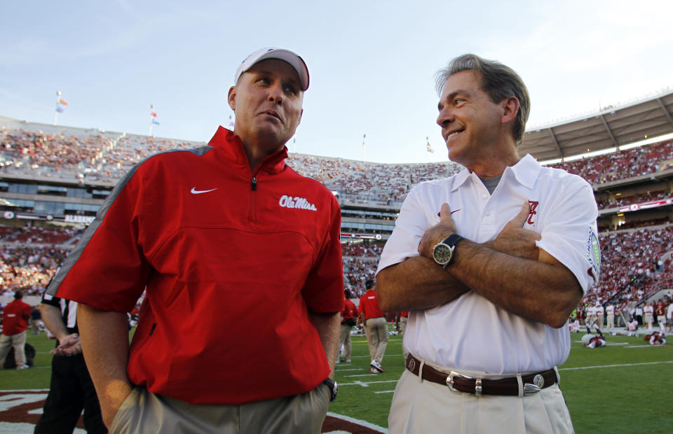 Hugh Freeze, left, coached Ole Miss to wins over Nick Saban and Alabama in 2014 and 2015. (AP Photo/Butch Dill, File)