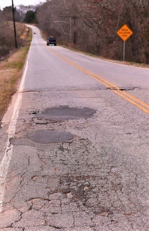 Patching potholes like these on Old Canaan Road in Spartanburg County keeps Spartanburg County public works crews busy throughout the year.