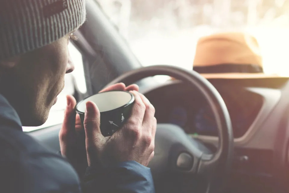 Person waiting in the car for the screen to warm up. (Getty Images)