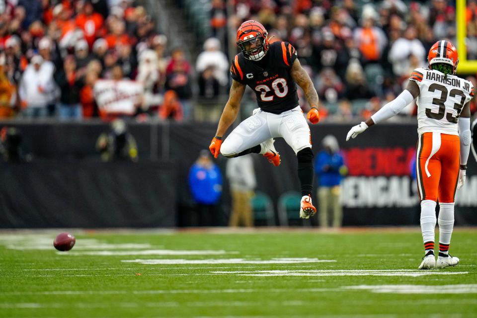 Cincinnati Bengals running back Joe Mixon (28) celebrates a first down carry in the fourth quarter of the NFL Week 14 game between the Cincinnati Bengals and the Cleveland Browns at Paycor Stadium in Cincinnati on Sunday, Dec. 11, 2022. The Bengals improved to 9-4 with a 23-10 win over the Browns.