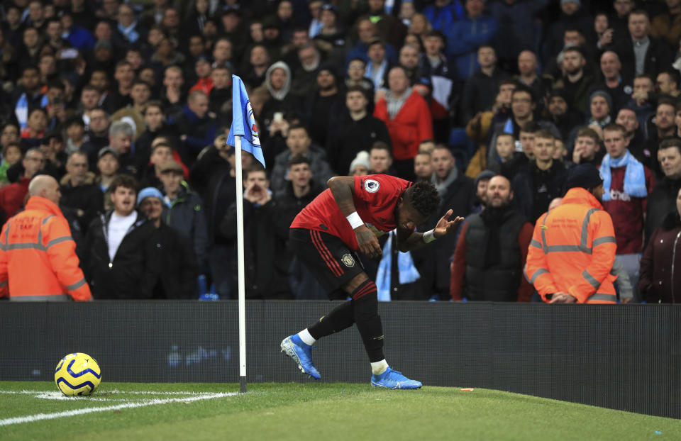 Manchester United's Fred reacts after objects are thrown at him during the English Premier League soccer match at the Etihad Stadium, Manchester, England Saturday Dec. 7, 2019. (Mike Egerton/PA via AP)