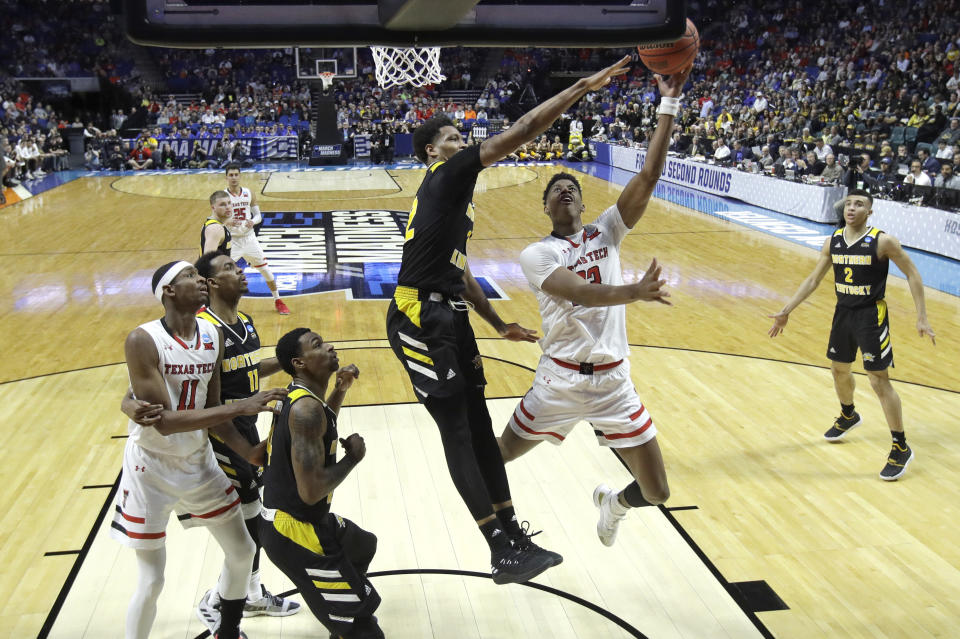 Texas Tech's Jarrett Culver puts up a shot under pressure from Northern Kentucky's Dantez Walton during the second half of a first round men's college basketball game in the NCAA Tournament Friday, March 22, 2019, in Tulsa, Okla. Texas Tech won 72-57. (AP Photo/Charlie Riedel)