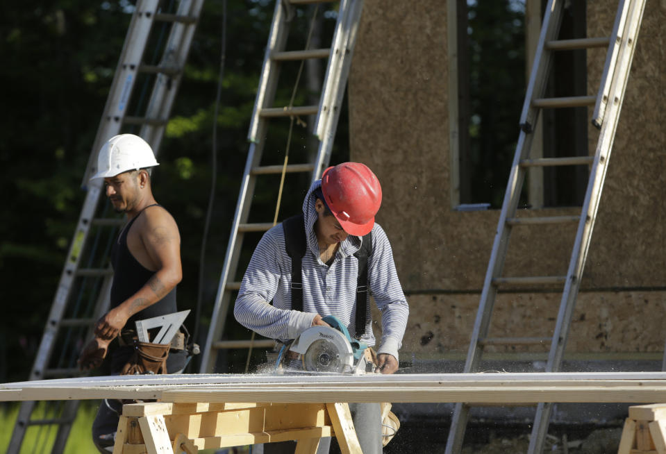 Carpenters cut fascia trimwork at a housing site at Mid-Atlantic Builders "The Villages of Savannah" development in Brandywine, Maryland May 31, 2013. REUTERS/Gary Cameron