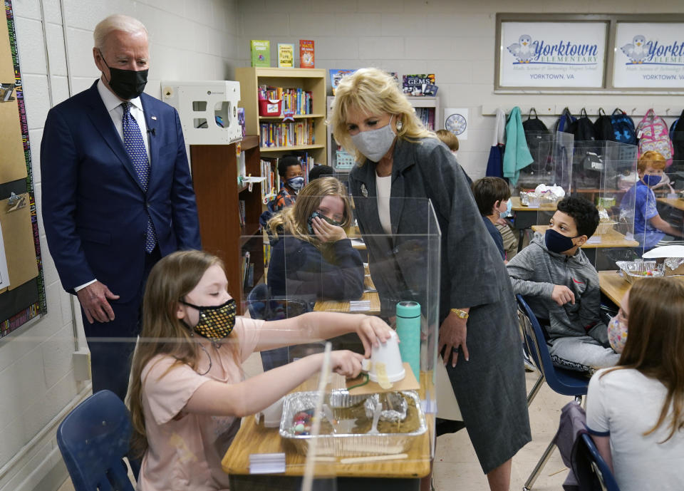 President Joe Biden and first lady Jill Biden, watch a student demonstrate her project, during a visit to Yorktown Elementary School, Monday, May 3, 2021, in Yorktown, Va. (AP Photo/Evan Vucci)