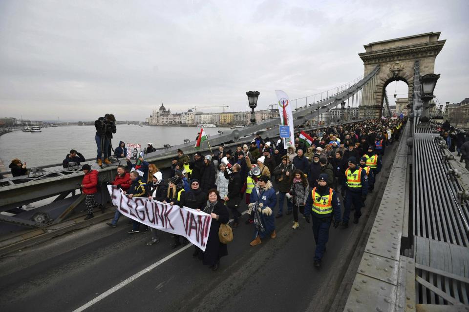 Demonstrators carry a banner reading 'We are fed up' as they protest against the recent amendments to the labour code, dubbed 'slave law' by opposition forces, in downtown Budapest, Hungary, Saturday, Jan. 19, 2019. (Marton Monus/MTI via AP)