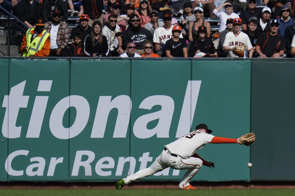 San Francisco Giants right fielder Joc Pederson is unable to catch a two-run double by Arizona Diamondbacks' Sergio Alcántara during the seventh inning of a baseball game in San Francisco, Saturday, Oct. 1, 2022. (AP Photo/Godofredo A. Vásquez)