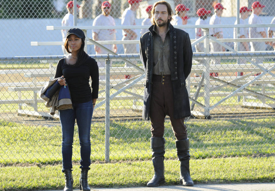 In this Sept. 26, 2013 photo provided by Fox, the stars of “Sleepy Hollow” appear in a scene from the TV show. Nicole Beharie, left, plays police Lt. Abbie Mills and Tom Mison plays Ichabod Crane. The new show, inspired by the tale of the Headless Horseman, has spurred interest in the village of Sleepy Hollow, N.Y. (AP Photo/Fox)