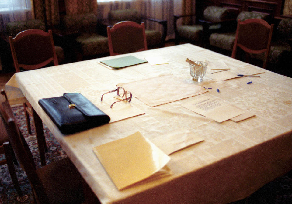 FILE - A table with some documents and glasses are seen after the signing of an agreement terminating the Soviet Union and declaring the creation of the Commonwealth of Independent States in Viskuli, Belarus, on Dec. 8, 1991. The agreement by the leaders of the Soviet republics of Russia, Ukraine and Belarus dealt the final, deadly blow to the USSR. (AP Photo/Yuri Ivanov, File)