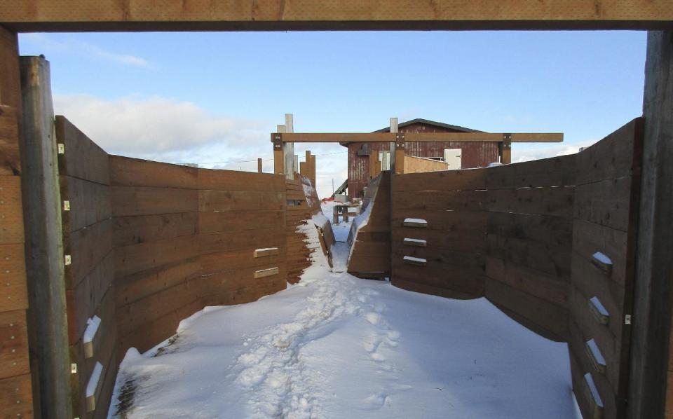 This Nov. 16, 2015 photo provided by Dale Smith shows a revitalized corral in Mekoryuk, Alaska. The corral is part of a federally funded endeavor to expand the tribal government's commercial reindeer subsidiary with the herd that was introduced a century ago. (Dale Smith via AP)