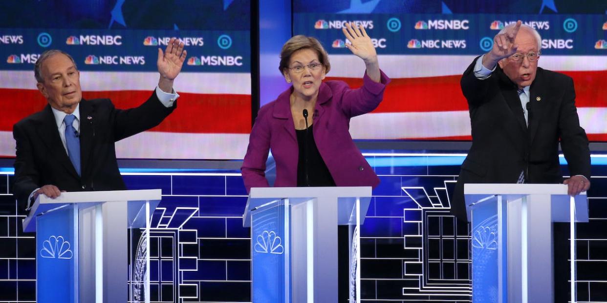 Democratic presidential candidates (L-R) former New York City mayor Mike Bloomberg, Sen. Elizabeth Warren (D-MA) and Sen. Bernie Sanders (I-VT) raise their hands during the Democratic presidential primary debate at Paris Las Vegas on February 19, 2020.