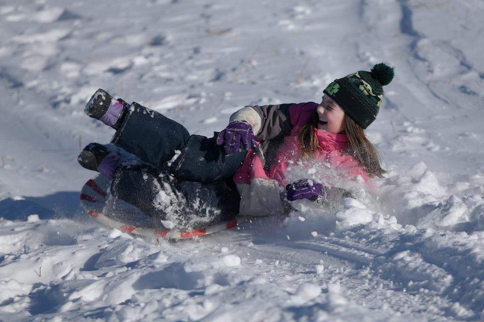 Kittery resident Elliana Dunn, 8, sleds at Wagon Hill Farm in Durham Sunday, Jan. 30, 2022 following a blizzard the previous day.