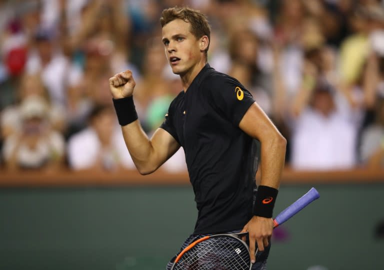 Vasek Pospisil of Canada celebrates scoring a point during his straight sets win against Andy Murray of Britain in their BNP Paribas Open second round match, at Indian Wells Tennis Garden in California, on March 11, 2017