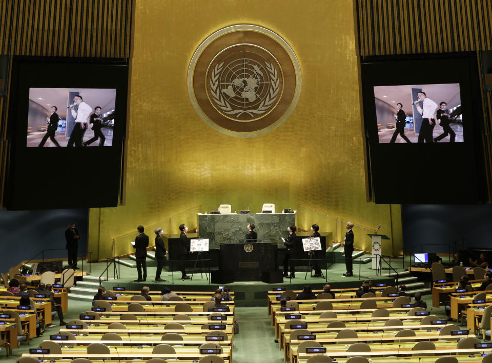 Members of South Korean K-pop band BTS watch a music video on the General Assembly Hall monitors during a meeting on Sustainable Development Goals at the 76th session of the U.N. General Assembly at U.N. headquarters on Monday, Sept. 20, 2021. (John Angelillo/Pool Photo via AP)