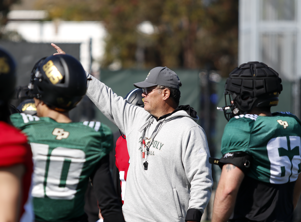 Coach Paul Wulff conducts drills during the Cal Poly football team’s spring practices at Doerr Family Field on April 14, 2023.
