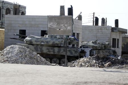 A view of armoured vehicles moved by Shi'ite Houthi rebels inside a school compound that was taken over by them, during recent fighting with government forces in Sanaa September 29, 2014. REUTERS/Mohamed al-Sayaghi