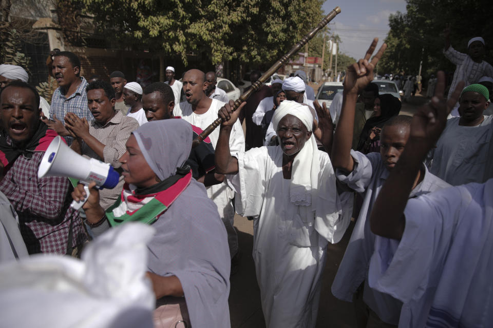 People protest in Khartoum, Sudan, after a military coup earlier this week, Friday, Oct. 29, 2021. The coup threatens to halt Sudan's fitful transition to democracy, which began after the 2019 ouster of long-time ruler Omar al-Bashir and his Islamist government in a popular uprising. It came after weeks of mounting tensions between military and civilian leaders over the course and pace of that process. (AP Photo / Marwan Ali)