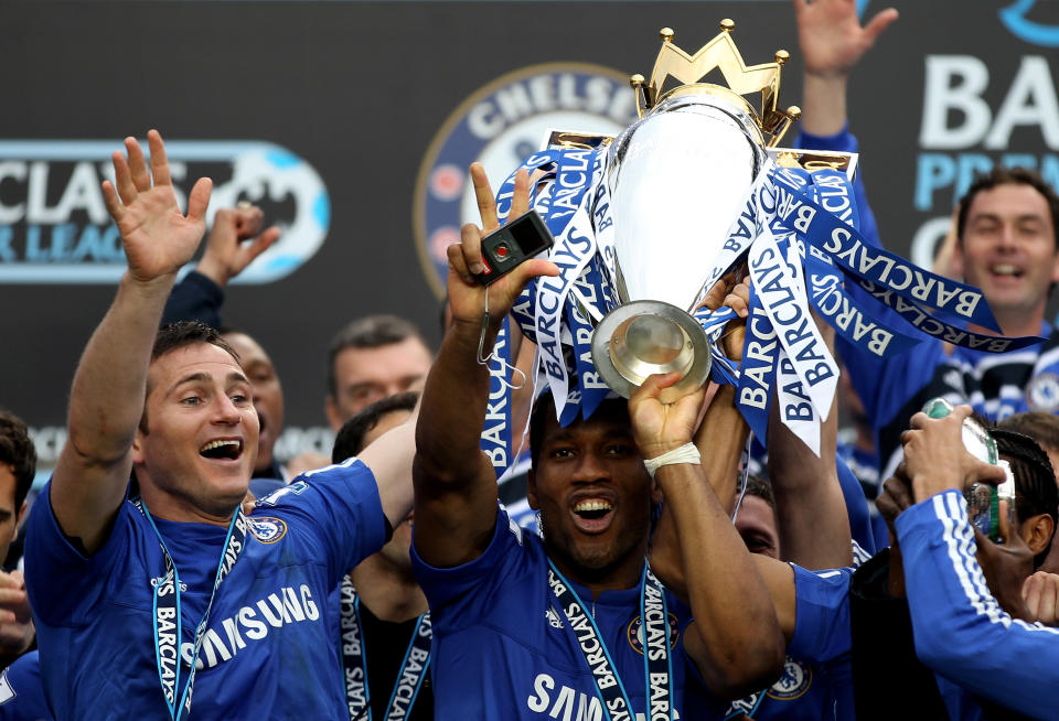 LONDON, ENGLAND - MAY 09:  (L to R) Chelsea's Frank Lampard and Didier Drogba celebrate with the trophy after winning the league with an 8-0 victory during the Barclays Premier League match between Chelsea and Wigan Athletic at Stamford Bridge on May 9, 2010 in London, England.  (Photo by Chelsea FC/Chelsea FC via Getty Images)