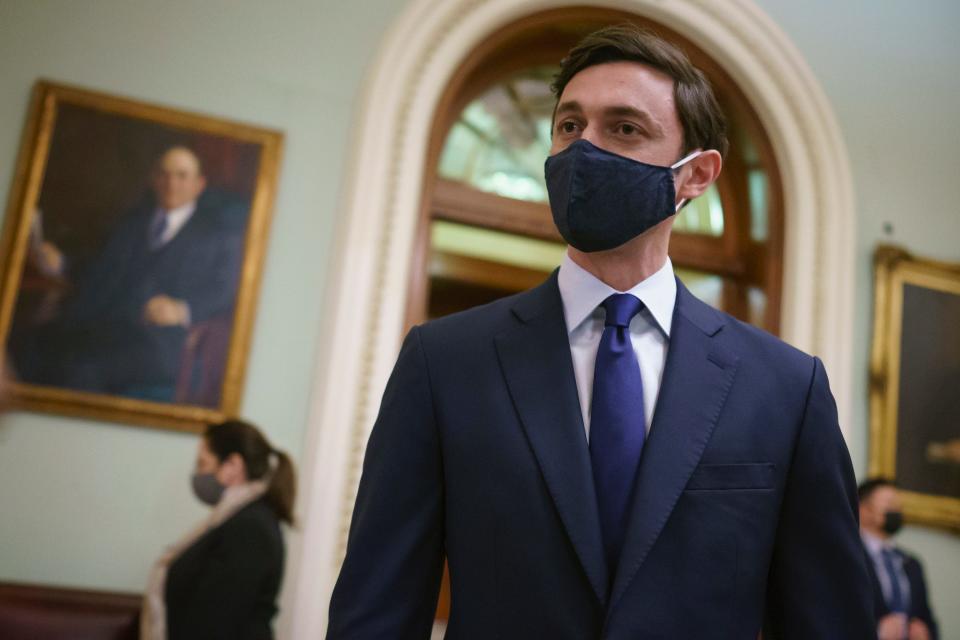 Sen. Jon Ossoff, D-Ga., speaks to reporters outside the Senate chamber just after being sworn-in by Vice President Kamala Harris, at the Capitol in Washington, Wednesday, Jan. 20, 2021.