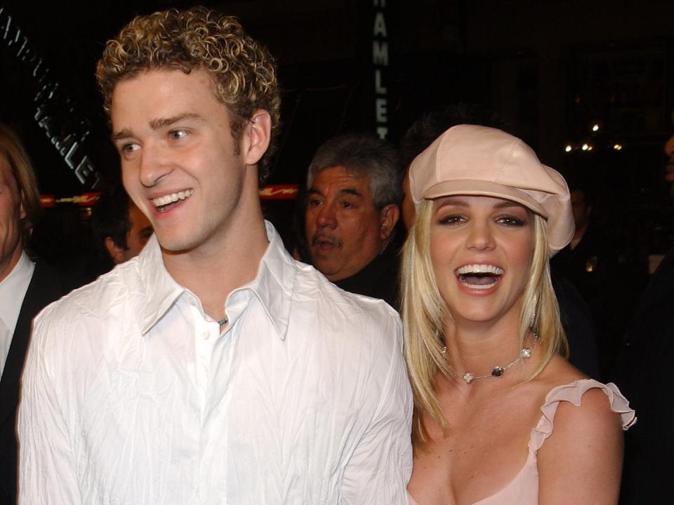 Justin Timberlake and Britney Spears smiling at a premiere.